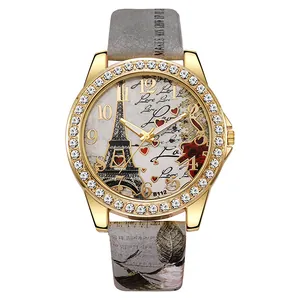 Montre quartz femme avec cadran Tour Eiffel, lunette en cristal et bracelet gris à fleurs