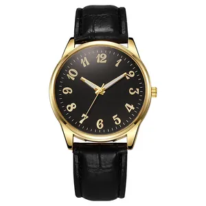 Macro detail of luxury gold watch with black leather strap and Arabic numerals