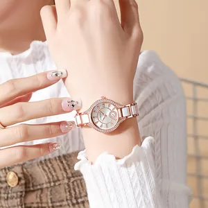 Elegant rose gold and white ceramic quartz watch for women with crystal encrusted bezel