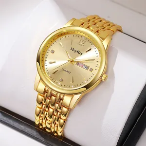 Detailed close-up of a gold business quartz watch with date and week display on a soft cushion