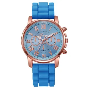 Detail of blue quartz watch with rose gold case and textured silicone strap