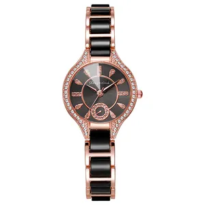 Detailed macro view of the rose gold dial set with sparkling crystals and metal strap