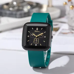 Square black fashion quartz watch with teal silicone strap and golden markers