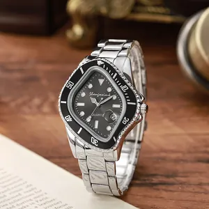 Detail view of a shield-shaped quartz watch with silver steel strap on a dark wood surface