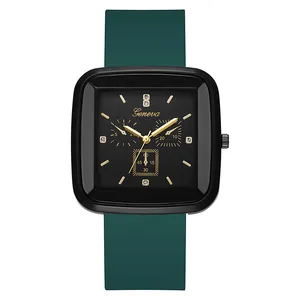 Detail of square quartz watch with dark green silicone strap and crystal accents