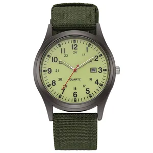 Army green quartz watch with canvas strap and date display on a military dial