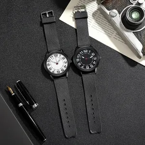 Minimalist quartz sports watch with mesh texture silicone strap in black and white