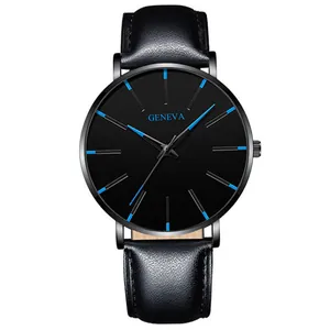 Macro shot of minimalist black watch dial with striking blue hour markers and Geneva logo