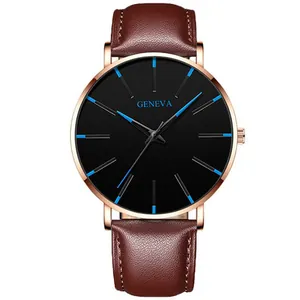 Detail of blue markers and hands on Geneva black dial with rose gold case and leather strap