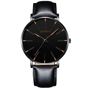 Minimalist black quartz watch with leather strap and orange hour markers detail