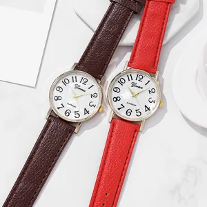 Damen Quarzuhr mit Perlmuttzifferblatt, Goldgehäuse und buntem Lederarmband