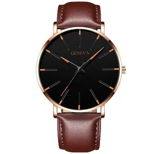 Detail of Geneva watch featuring brown leather strap and rose gold minimalist dial