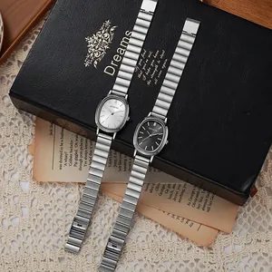 Elegant oval Geneva quartz watch with silver flexible strap on a black luxury gift box