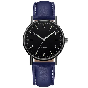 Macro shot of dark blue leather strap and black dial on luminous quartz watch