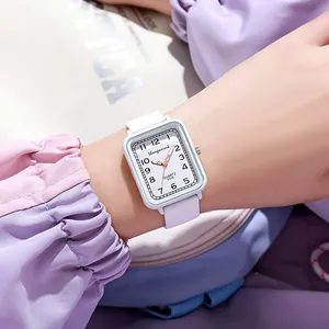 Elegant white square quartz watch for women with silicone strap on soft pastel background