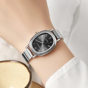Close-up of Geneva vintage oval watch with black dial and silver bamboo steel strap