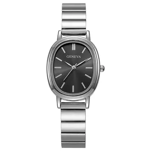 Detailed close-up of a silver oval watch with bamboo-style steel strap and black sunray dial