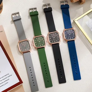 Flat lay of vintage square quartz watches in grey, green, black and navy with silicone bands