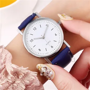 Luminous quartz watch with white dial, silver case, and navy blue leather strap for women