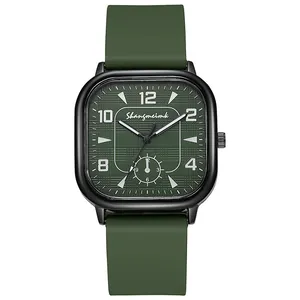 Macro detail of square dark green watch dial with grid pattern and black metal case
