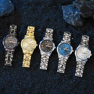Detailed collection of five steel quartz watches with dual calendar on dark gravel background