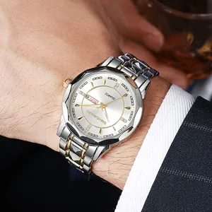 Detail of luxury men's quartz watch with steel strap and double calendar display