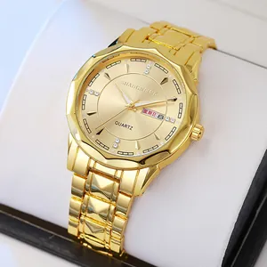 Luminous gold quartz watch with steel band and dual calendar on white display pillow