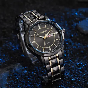 Macro detail of quartz watch with black sunray dial, gold accents and dual day-date display