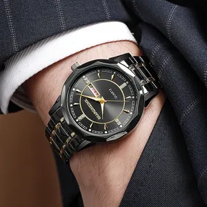 Detail of luminous men's quartz watch with dual calendar display and gold-tone hands