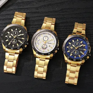 Detailed view of three McyKey men's chronograph watches with gold bands on wood
