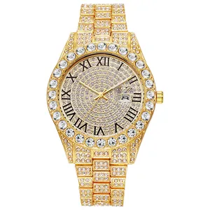 Detail of iced out gold watch featuring crystal-encrusted strap and Roman dial calendar