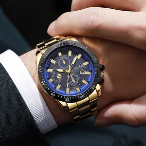 Close-up of gold men's watch with three-dial chronograph and calendar on wrist