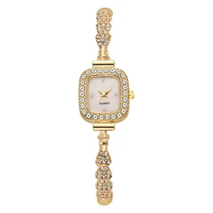 Montre à quartz carrée dorée pour femme ornée de strass brillants et cadran rose