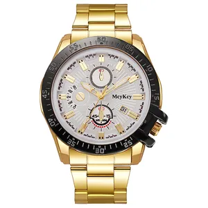 Detail of gold quartz watch face with three sub-dials and date window on white background