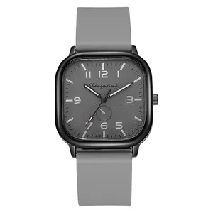 Macro shot of square case quartz watch with grey matte dial and soft silicone strap