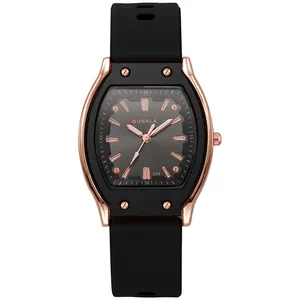 Detail of rose gold tonneau case with black bezel and grey brushed dial on silicone watch