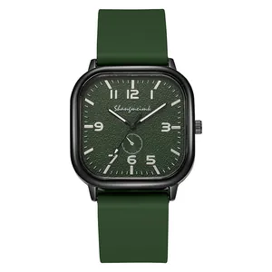 Detail view of square green quartz watch with textured dial and silicone strap
