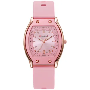 Detailed view of the rose gold tonneau case and pink silicone strap on this quartz watch