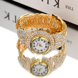 Luxury gold bangle watch for women with sparkling crystal bezel and woven metal strap