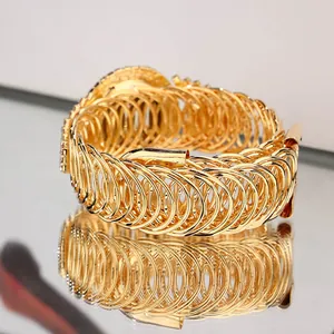 Fashionable hollow multi-layer gold metal wide cuff bracelet with a glossy mirror finish