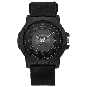 Detail of quartz watch featuring unique word hour markers and black nylon sport strap