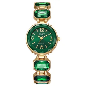 Montre quartz dorée pour femme avec cadran vert émeraude et bracelet en cristaux
