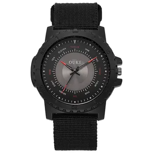 Macro shot of a black sports quartz watch with creative text hour markers and nylon strap