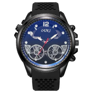 Macro detail of men's quartz watch featuring a sunburst blue dial and hollow rubber strap