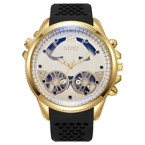 Detail of gold case watch with star-shaped hollow silicone strap and mechanical dial