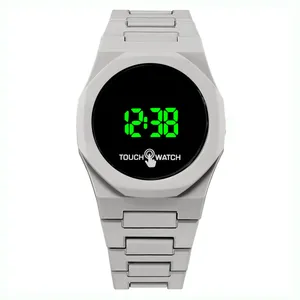 Close-up of matte grey LED touch watch with green digital display and octagonal bezel