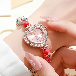 Luxurious heart-shaped quartz watch with rose gold diamond bezel and woven strap