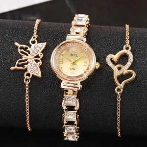 Elegant gold quartz watch set with rhinestone bracelet and heart charms on black background