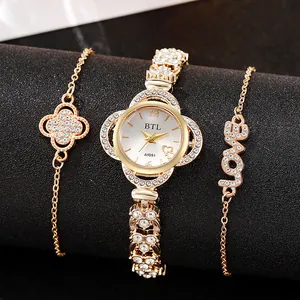 Women gold quartz watch and clover bracelet set with sparkling rhinestone details
