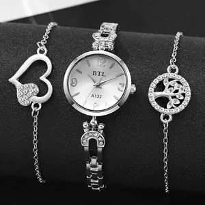 Detailed view of silver women's quartz watch set with crystal heart and tree of life bracelets